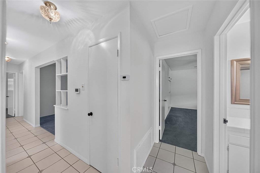 Hallway, front door to the left, Primary bedroom and bath. - 2471 Oakland Drive, La Habra CA 90631 - photo 23