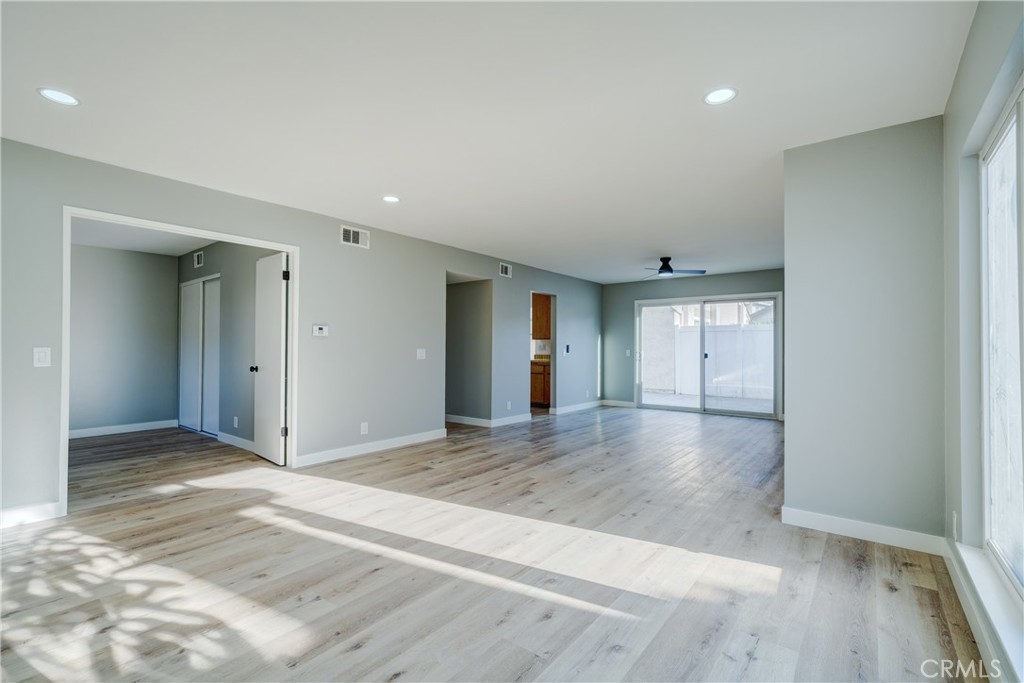 Open living room and dining areas with recessed lighting - 750 Hartford Lane, La Habra CA 90631 - photo 11