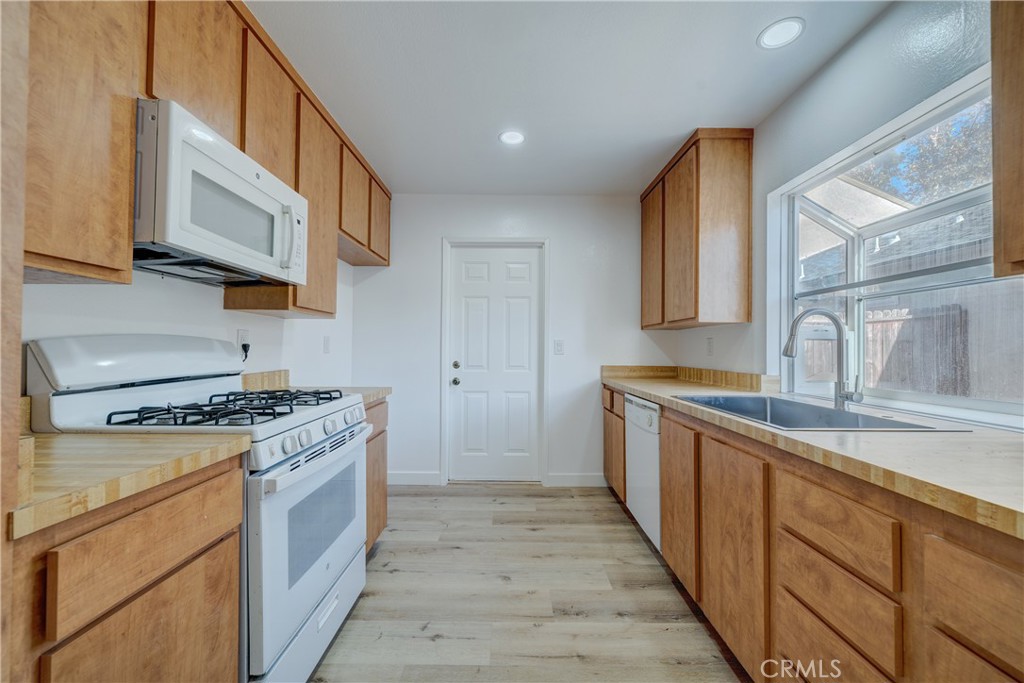 Kitchen with updated flooring - 750 Hartford Lane, La Habra CA 90631 - photo 14