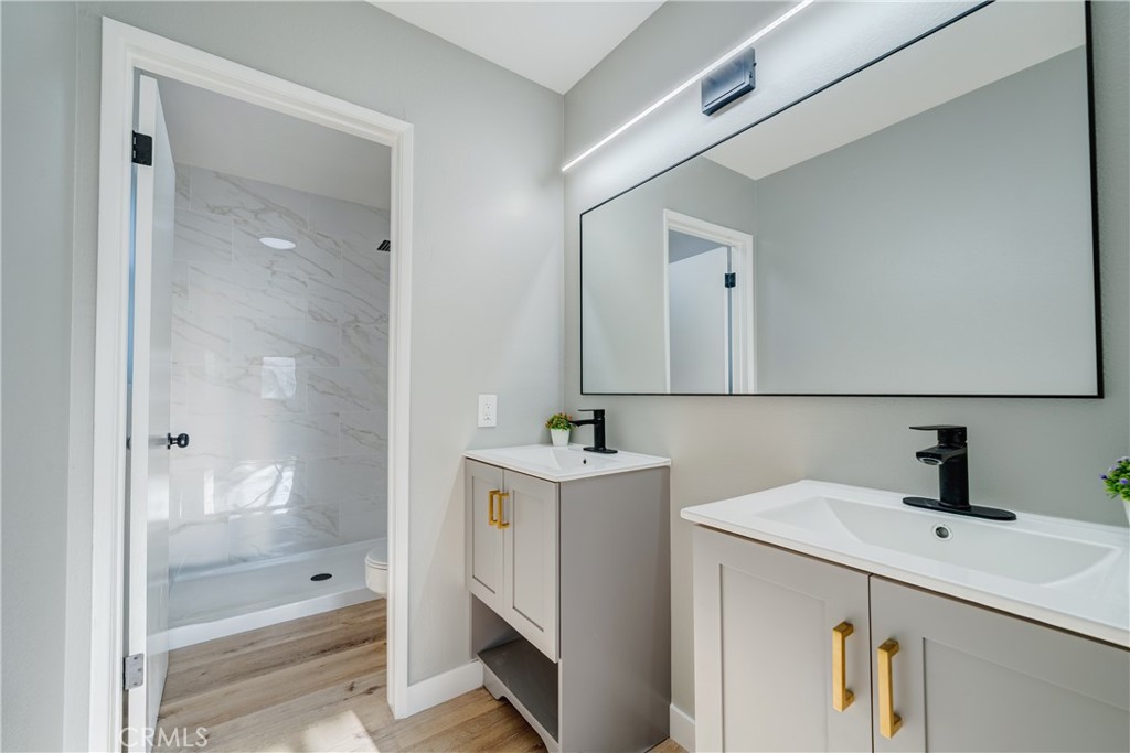 Primary bathroom with double vanities - 750 Hartford Lane, La Habra CA 90631 - photo 23