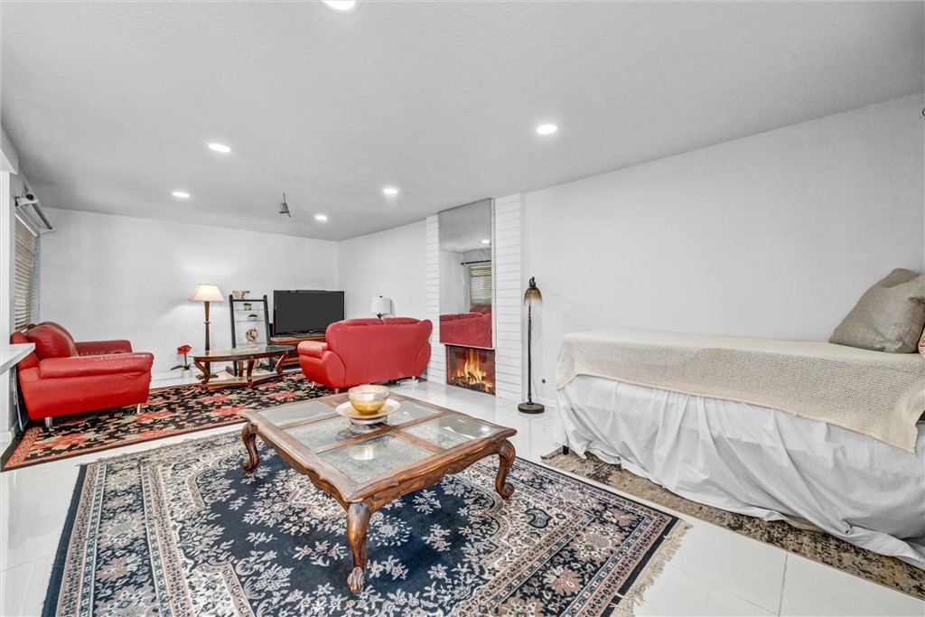 Bright and spacious room with tile flooring, a large window, and plenty of room for entertaining - 919 Glencliff, La Habra CA 90631 - photo 17