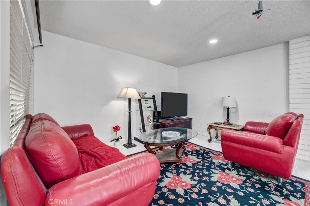 Cozy sitting area with room for a sofa, loveseat, and entertainment center. - 919 Glencliff, La Habra CA 90631 - photo 22