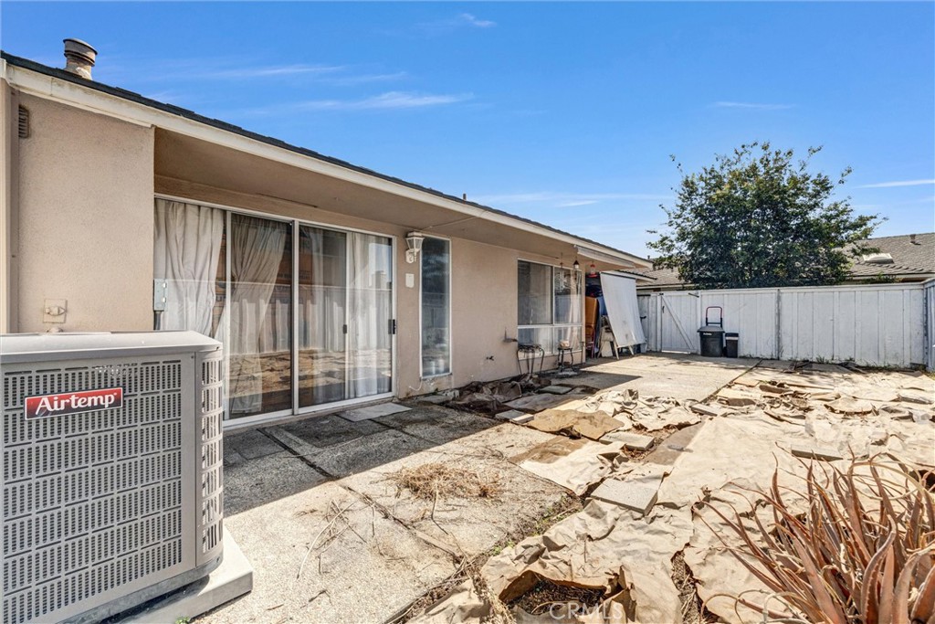 Private, fenced backyard with sliding glass door access from the living area and a concrete patio ready for your persona - 919 Glencliff, La Habra CA 90631 - photo 24
