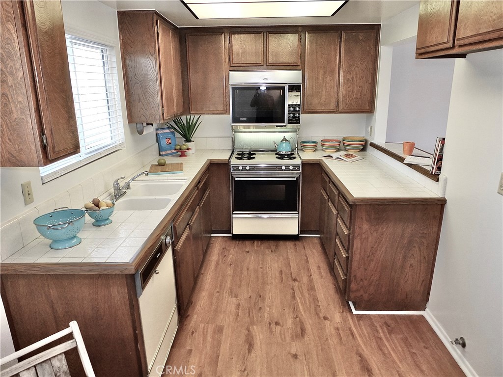 Well thought out kitchen with pass through and lots of cabinets - 949 W Imperial Highway A, La Habra CA 90631 - photo 3