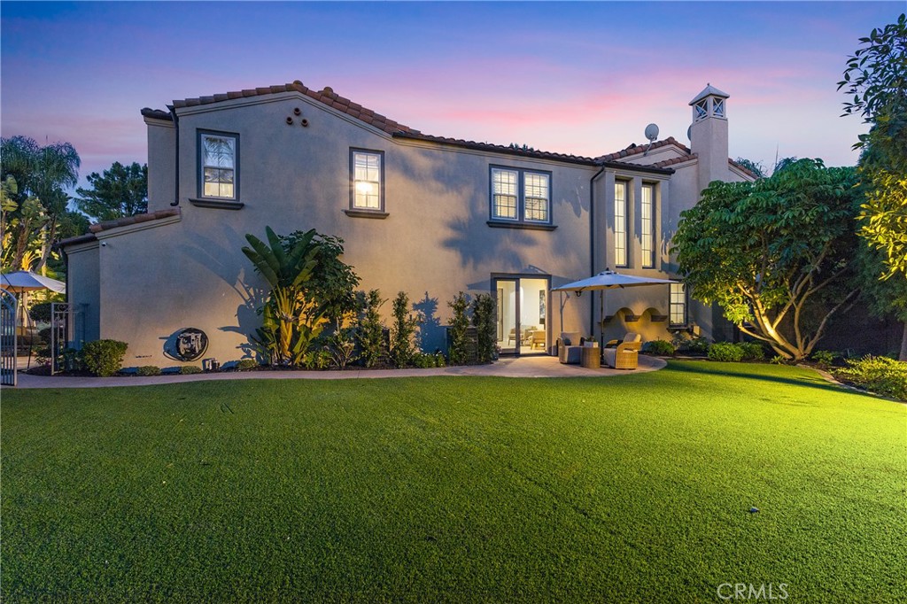 The grounds include a huge gated lawn- beautifully maintained and surrounded by mature foliage including fruit trees. - 1 Lennox Court, Ladera Ranch CA 92694 - photo 1