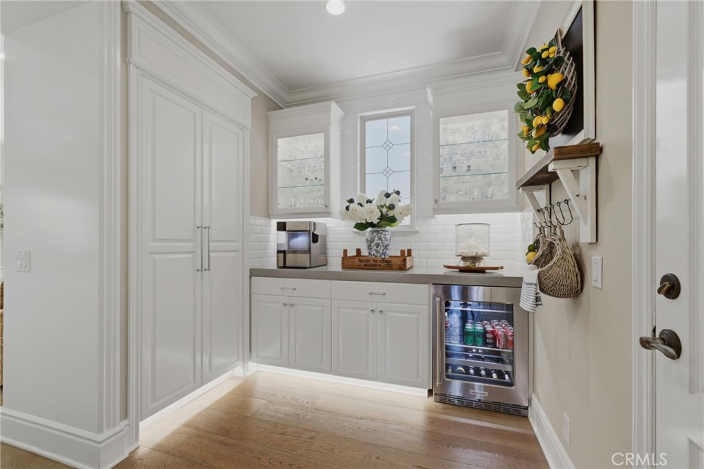 Butlers pantry with beverage fridge and custom storage cabinetry - 10 Jenny, Ladera Ranch CA 92694 - photo 24