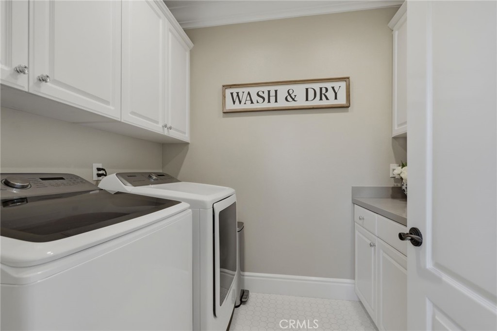 Upstairs laundry room with plenty of storage ~ - 10 Jenny, Ladera Ranch CA 92694 - photo 48
