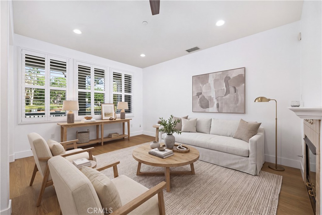 Family room ~ virtually staged - 123 Sklar 37, Ladera Ranch CA 92694 - photo 4