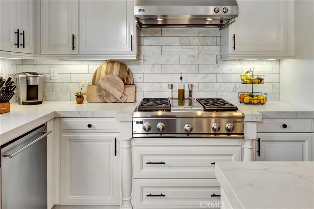 Top of the line appliances & marble backsplash. - 15 Julia Street, Ladera Ranch CA 92694 - photo 22