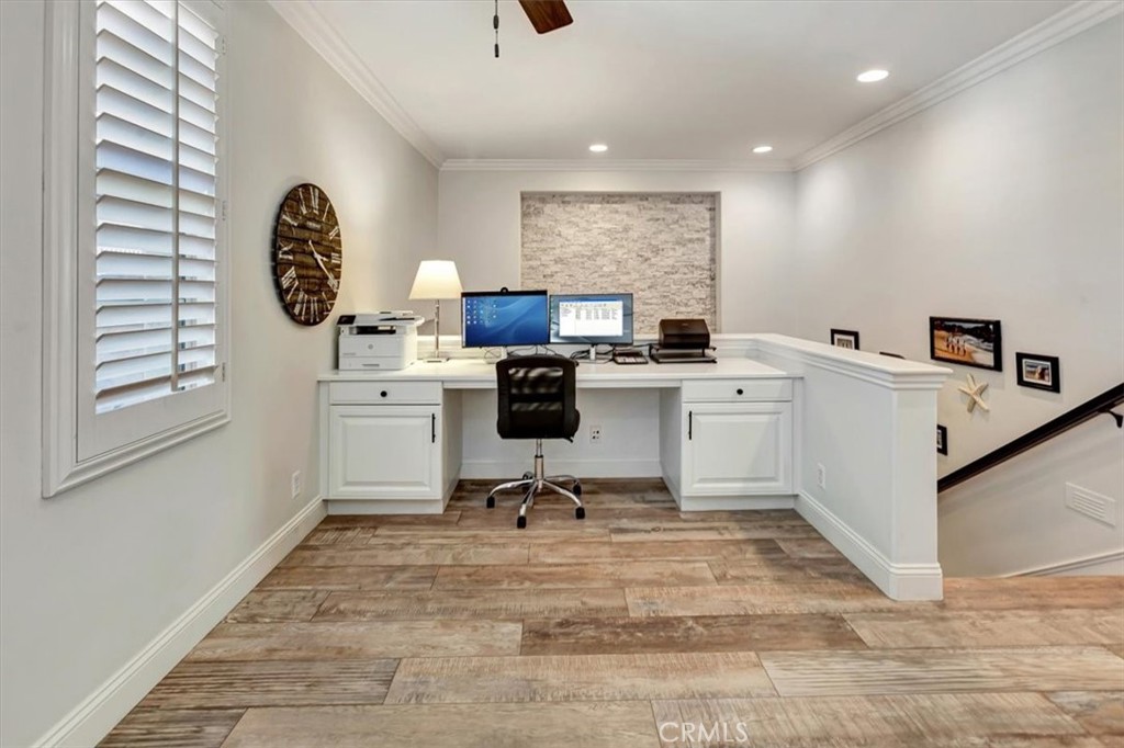 Upstairs landing area featuring a custom built-in office nook. - 15 Julia Street, Ladera Ranch CA 92694 - photo 24