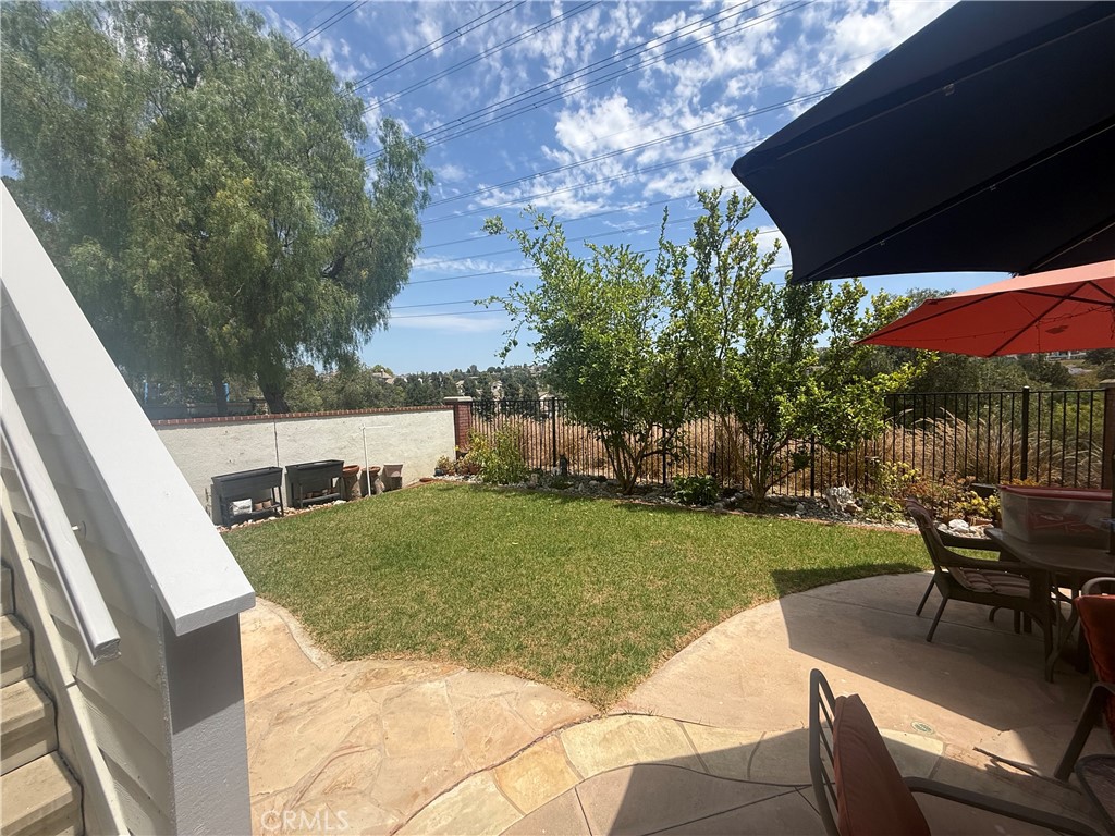 Back yard and stairs to bonus room Bedroom 5 - 16 Bower Lane, Ladera Ranch CA 92694 - photo 8