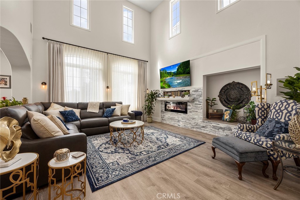 Living room with fireplace. (Digitally enhanced fire). - 16 Kempton Lane, Ladera Ranch CA 92694 - photo 15