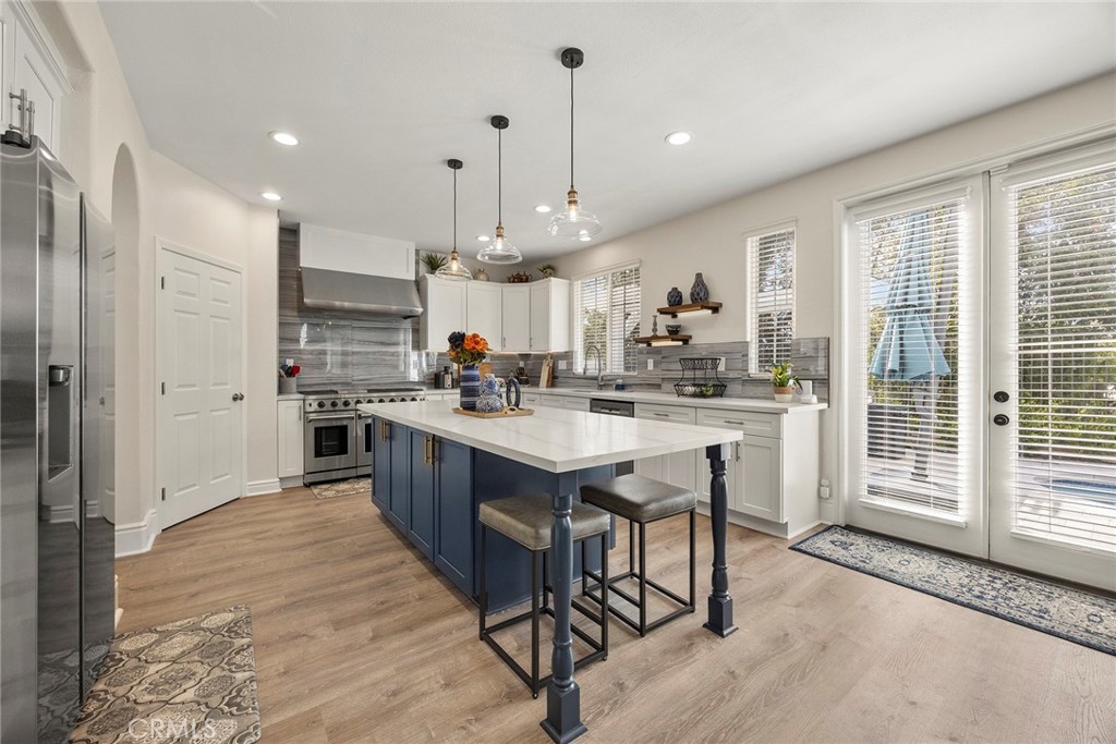 Kitchen island. French doors to backyard. - 16 Kempton Lane, Ladera Ranch CA 92694 - photo 25
