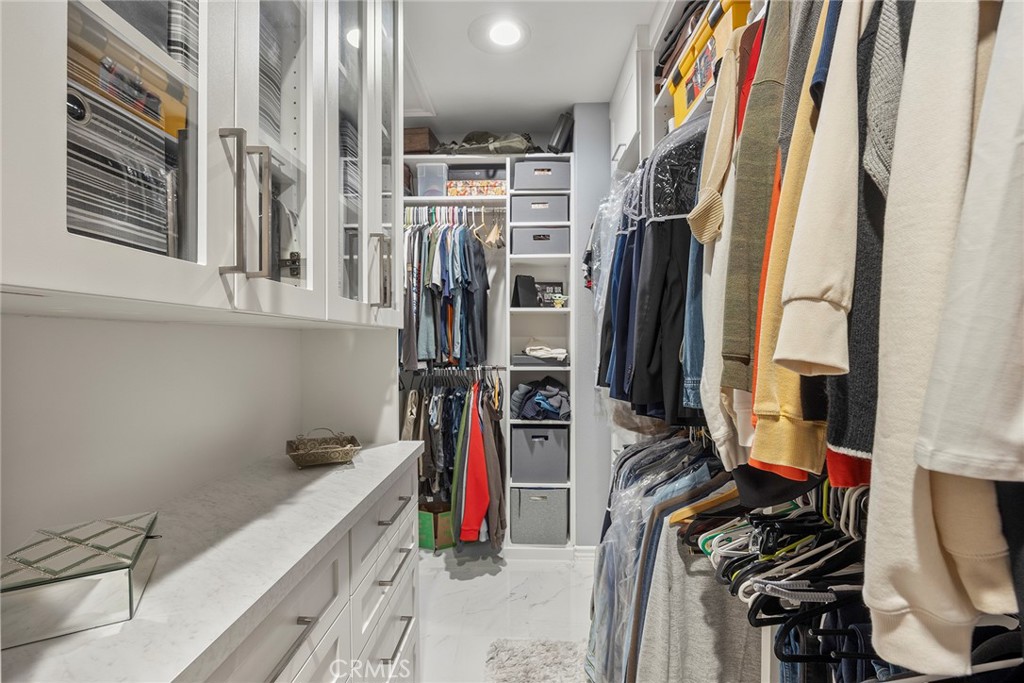 Primary bedroom closet with built-ins. - 16 Kempton Lane, Ladera Ranch CA 92694 - photo 44