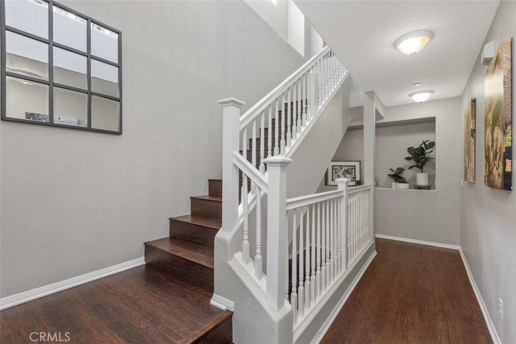 Beautiful detailed wood flooring throughout the home. Stair case and hallways, all bedrooms. - 25 Platinum, Ladera Ranch CA 92694 - photo 28