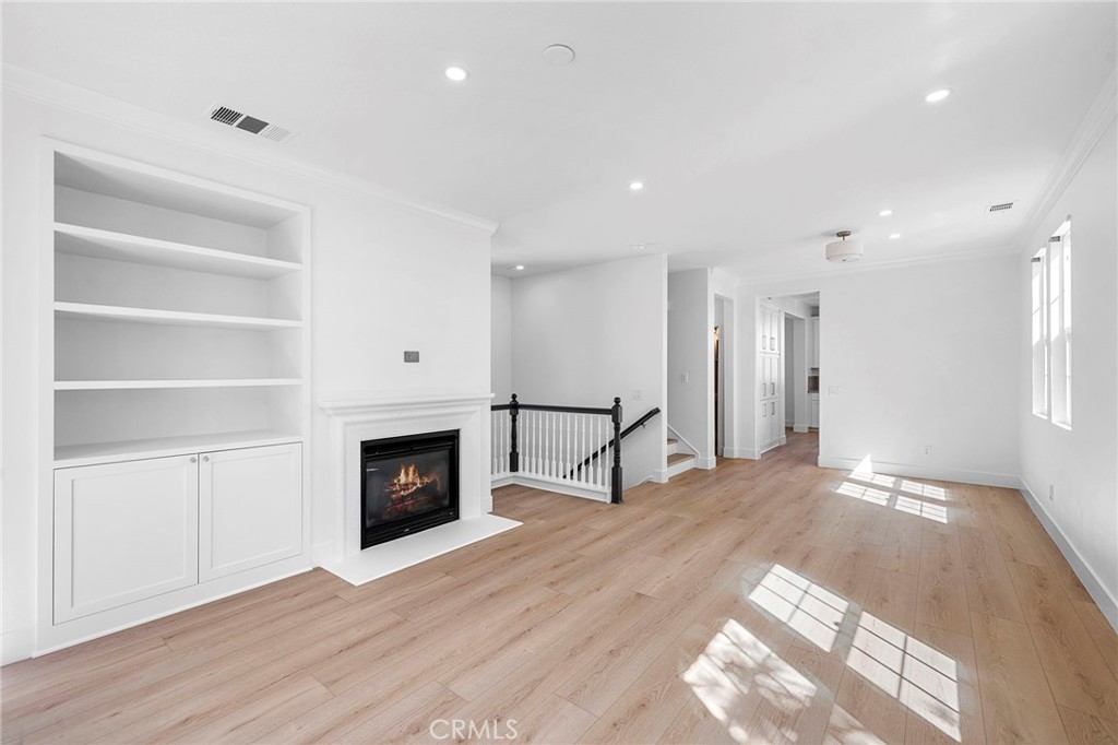 second floor great room with fireplace and shaker cabinets - 27 Rinehart, Ladera Ranch CA 92694 - photo 11