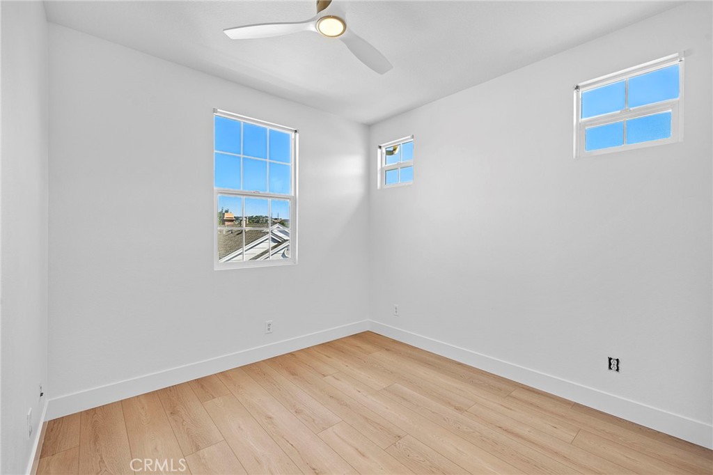 Upstairs bedroom with new ceiling fan, LVT flooring and paint - 27 Rinehart, Ladera Ranch CA 92694 - photo 24