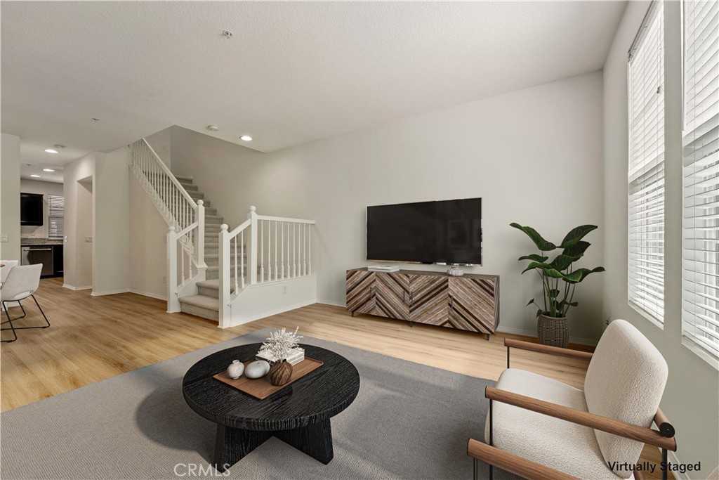 Great room - digitally enhanced with virtual staging - 30 Marcilla, Ladera Ranch CA 92694 - photo 5
