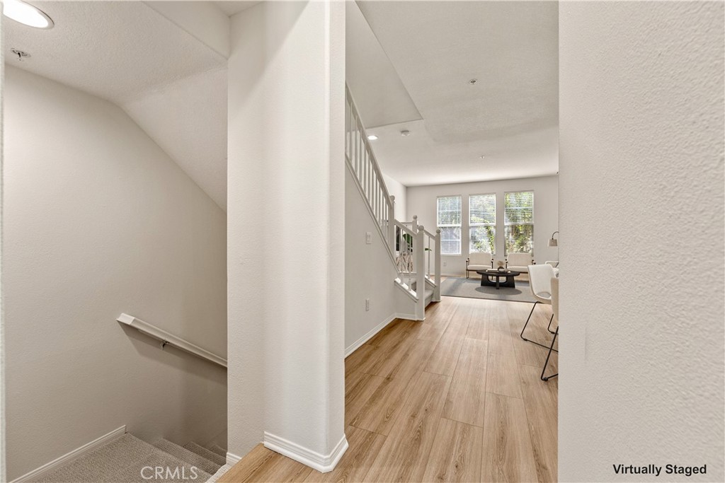 View toward entry staircase and great room. Image virtually staged.View toward entry staircase and great room. Image vir - 30 Marcilla, Ladera Ranch CA 92694 - photo 15
