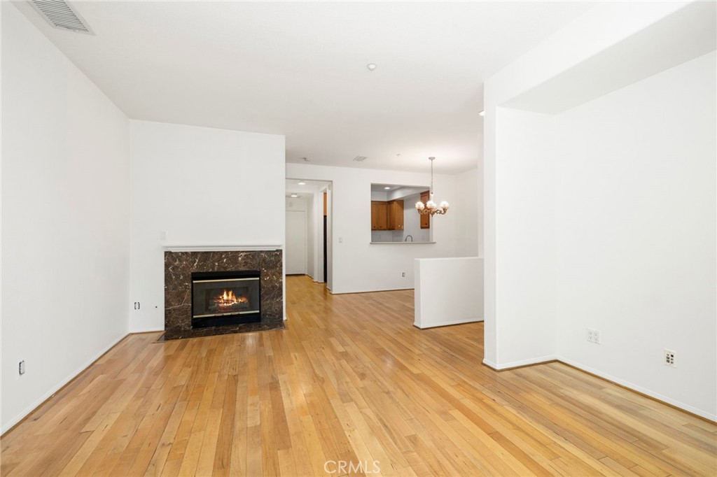 Private entrance leads to living room with fireplace, formal dining and kitchen. - 4 Toribeth Street 8, Ladera Ranch CA 92694 - photo 2