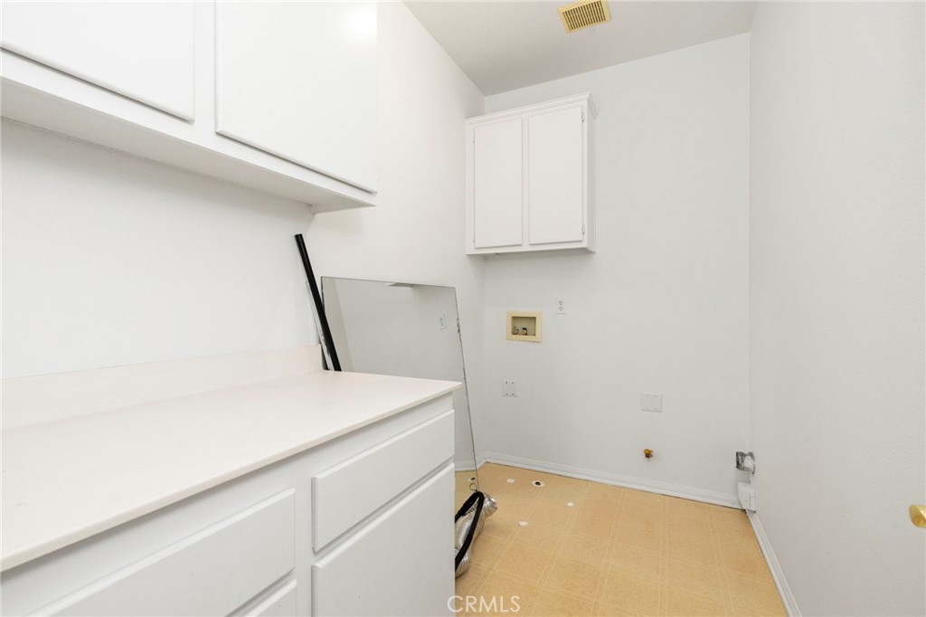 Laundry and linen area with ample storage - 4 Toribeth Street 8, Ladera Ranch CA 92694 - photo 14