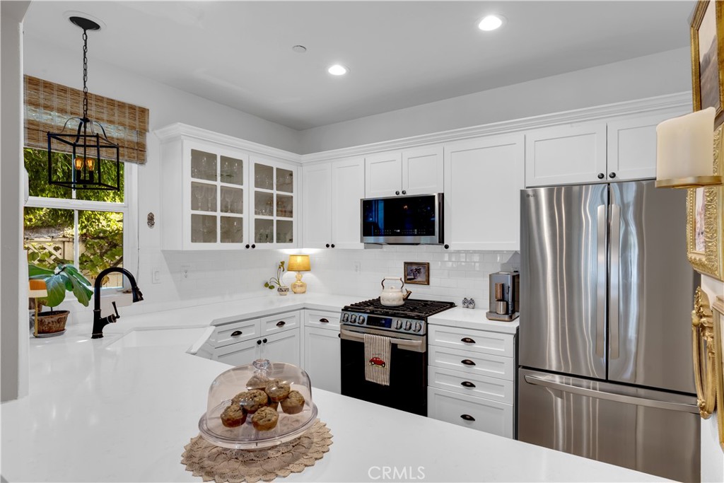 Kitchen remodel includes display cabinets and a doored pantry - 5 Surrey Farm, Ladera Ranch CA 92694 - photo 6