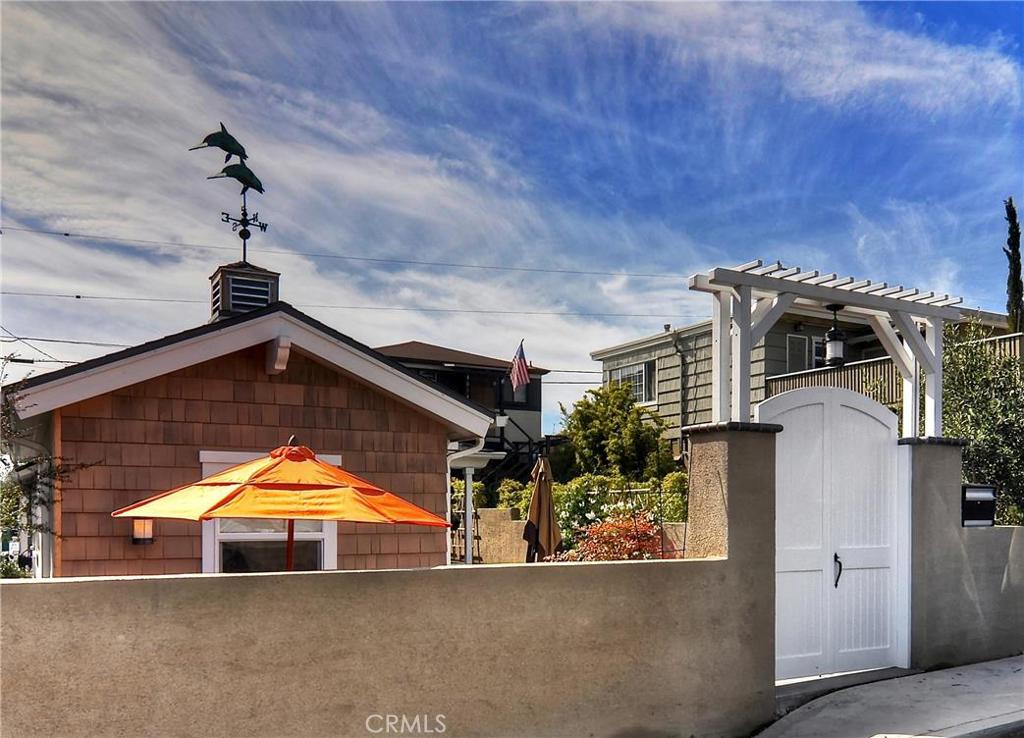 Front of property on Glenneyre Street, private gated courtyard entry - 1029 Glenneyre Street, Laguna Beach CA 92651 - photo 1