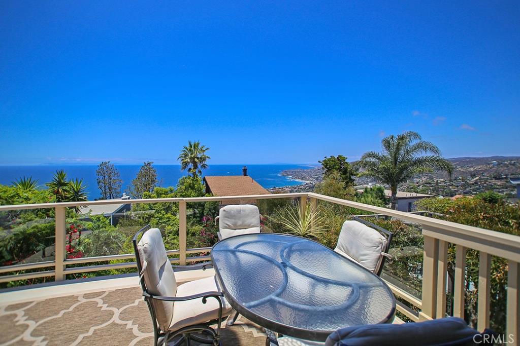 The open floor plan includes living and dining room that has access to a large entertainer’s dream deck - 1029 Katella Street, Laguna Beach CA 92651 - photo 1