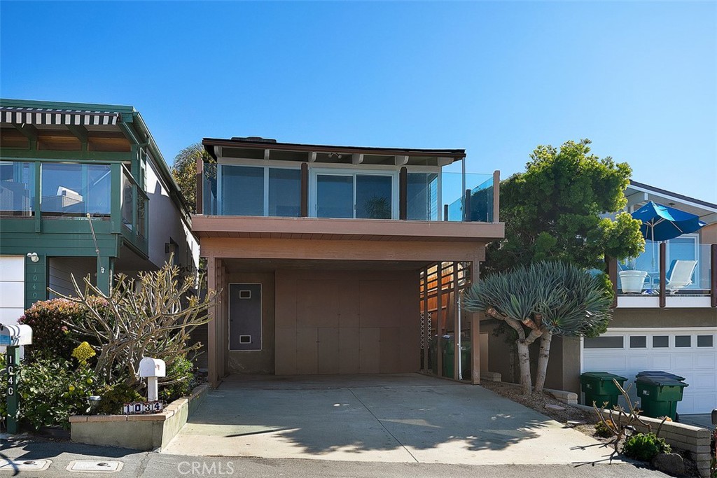 Front of home, large deck off living room, carport has plenty of storage cabinets and driveway can accommodate four aver - 1034 Miramar Street, Laguna Beach CA 92651 - photo 1