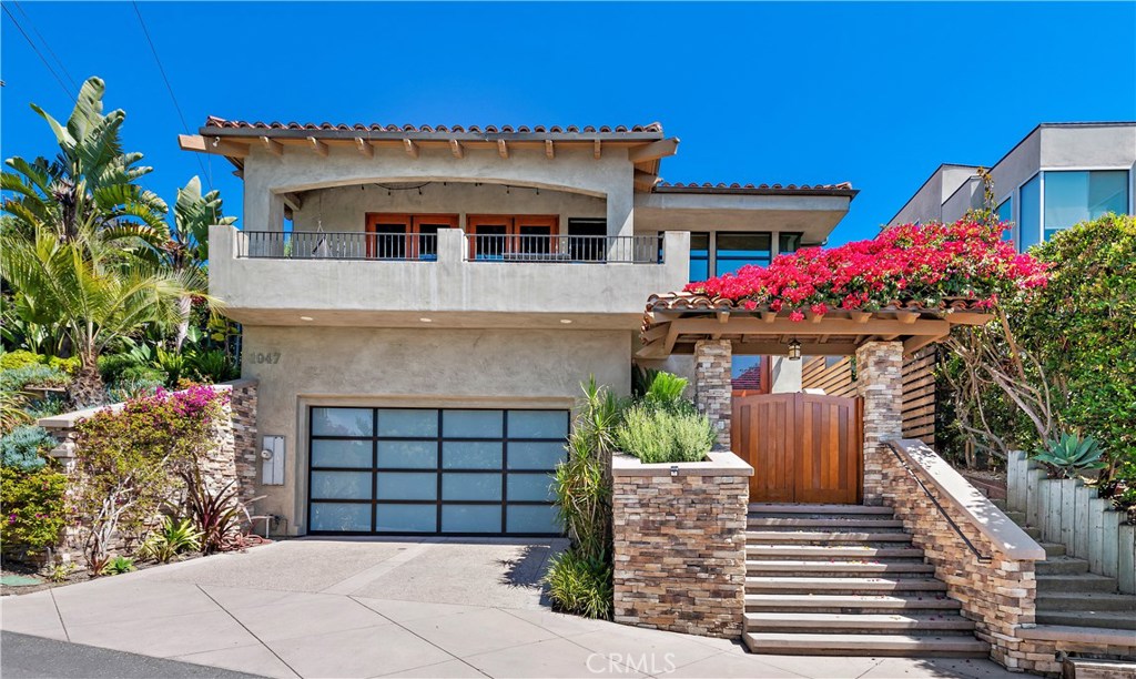 1047 Summit Way rests on a quite street-to-street lot with beautiful ocean views. - 1047 Summit Way, Laguna Beach CA 92651 - photo 1
