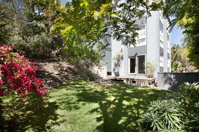 What a lovely spot to relax under the shady trees. Perfect home for all to enjoy with so many private spaces all around - 1055 Wykoff Way, Laguna Beach CA 92651 - photo 1