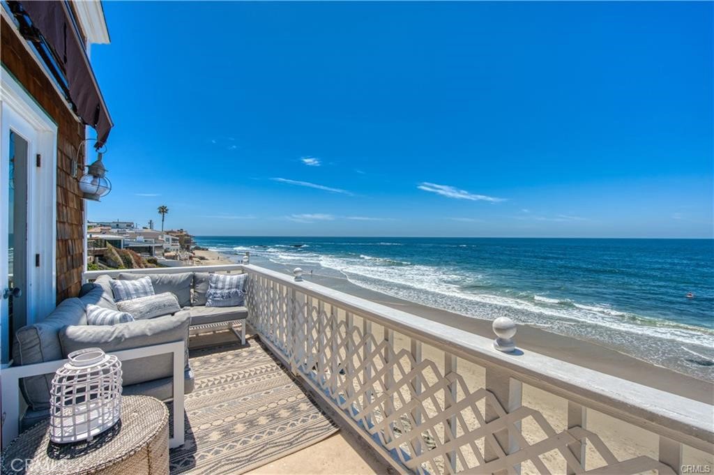 Main level deck with outdoor sectional and a spot to watch dolphins, surfers and beachgoers. - 1061 Gaviota Drive, Laguna Beach CA 92651 - photo 1