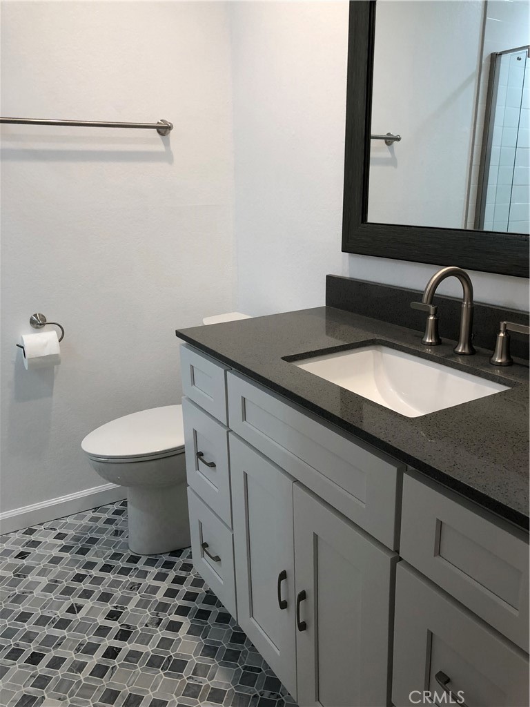 Main level bathroom with beautiful flooring tile work - 1064 Santa Ana, Laguna Beach CA 92651 - photo 11