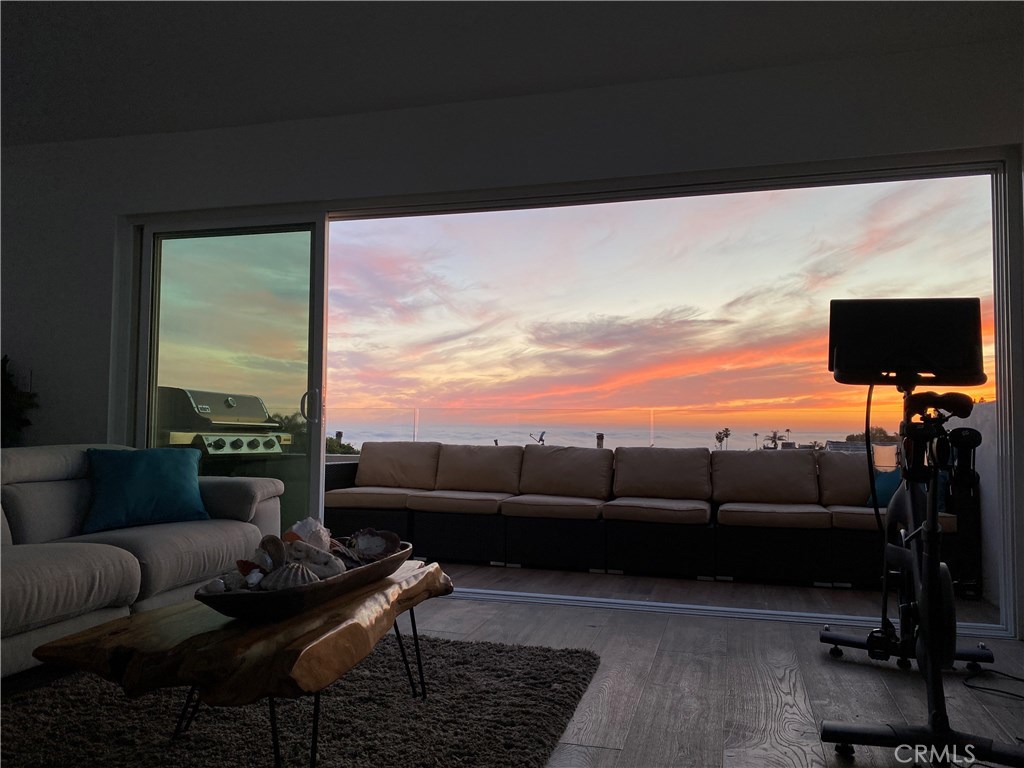 Un retouched photo standing in family room using an iphone. Clouds are covering Santa Catalina Island directly in front. - 1072 Santa Ana Street, Laguna Beach CA 92651 - photo 1