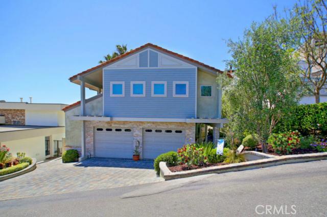 Beautiful soft contemporary home surrounded by views of twinkling city lights and the blue Pacific Ocean - 1075 Noria Street, Laguna Beach CA 92651 - photo 1