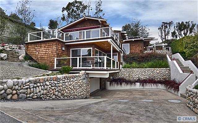 Front view showing upper and lower level deck areas, driveway below with entry to large two car garage. - 1076 DYER Place, Laguna Beach CA 92651 - photo 1
