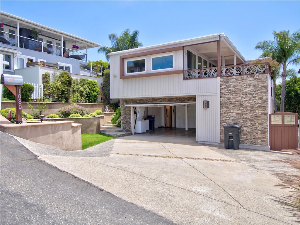 Front of House with Garage door opened - 1080 Noria, Laguna Beach CA 92651 - photo 2
