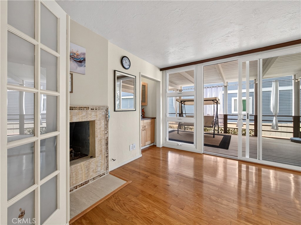This is the 3rd Bedroom with a Fireplace or it can be an Entertainment Room. See it Opens up to the Patio. Makes it easy - 1080 Noria, Laguna Beach CA 92651 - photo 32