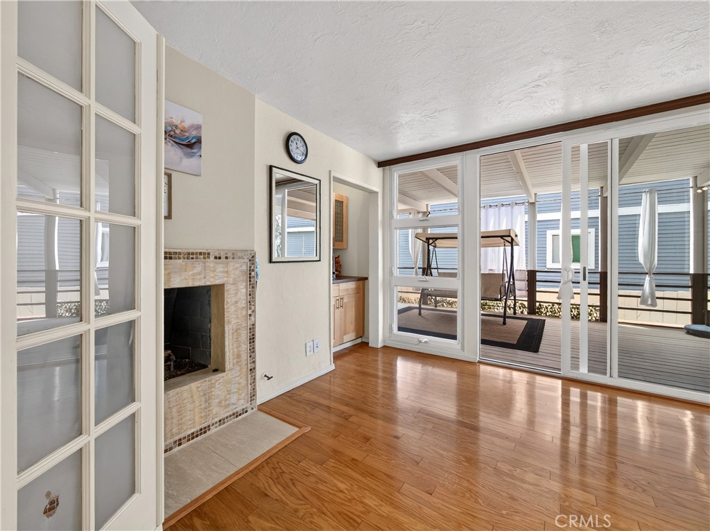 This is the 3rd Bedroom with a Fireplace or it can be an Entertainment Room. See it Opens up to the Patio. Makes it easy - 1080 Noria, Laguna Beach CA 92651 - photo 33