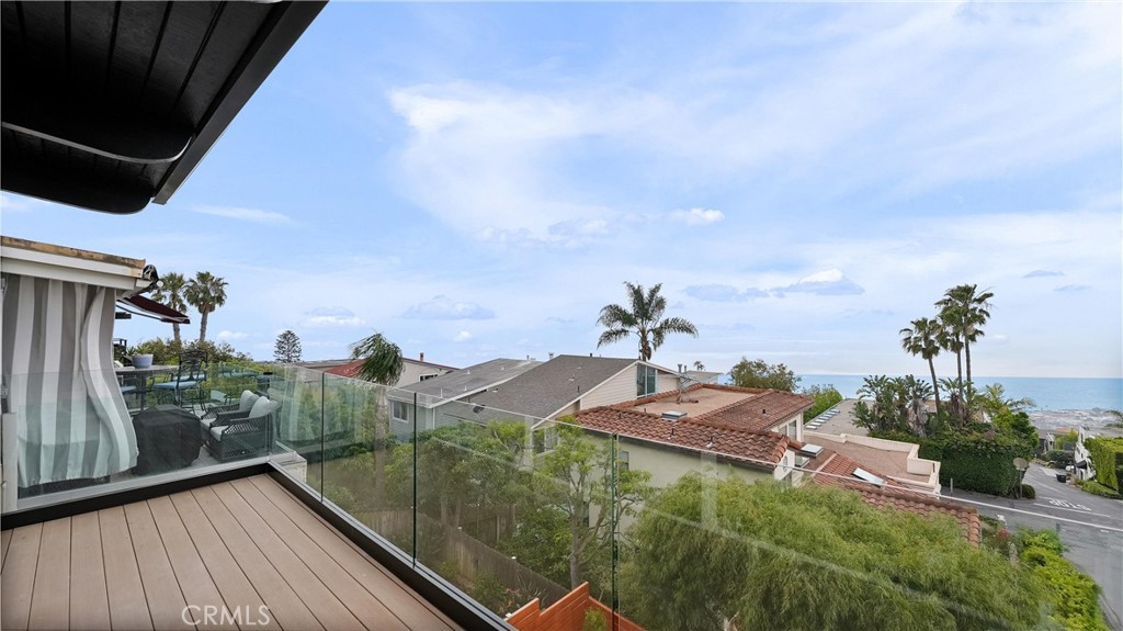 The attached balcony extends the living space and captures beautiful ocean and white-water views. - 1095 Miramar, Laguna Beach CA 92651 - photo 5