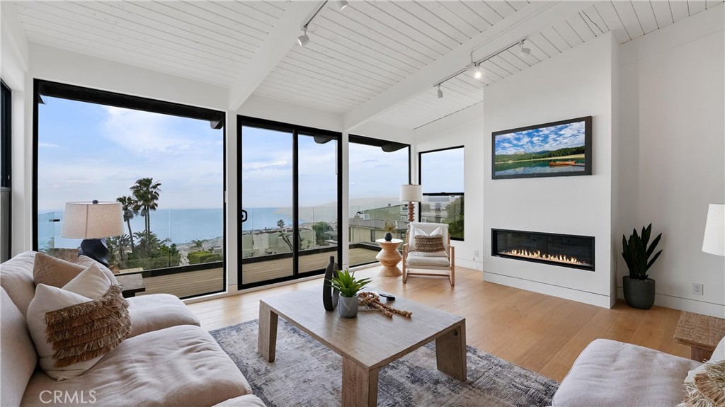 A perfect space to relax, gather, and enjoy the coastal lifestyle with ocean views from the living room and attached bal - 1095 Miramar, Laguna Beach CA 92651 - photo 8