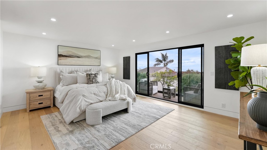 Primary bedroom with its own balcony, offering ocean views and a beautiful white-water backdrop. - 1095 Miramar, Laguna Beach CA 92651 - photo 22