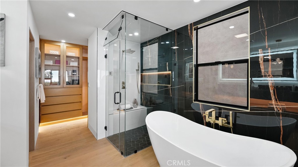 Spa-like primary bathroom with steam shower, dual custom vanity sinks, and designer finishes. - 1095 Miramar, Laguna Beach CA 92651 - photo 27