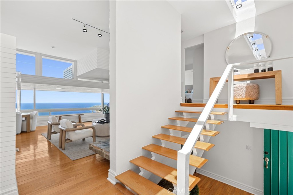 The approximately 1,764 square-foot residence offers a light-filled floor plan featuring three bedrooms and two bathroom - 1105 Summit Drive, Laguna Beach CA 92651 - photo 6