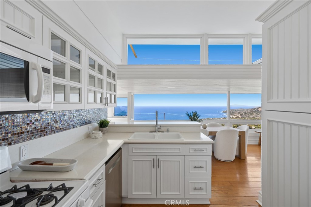he open kitchen is perfectly positioned to enjoy exceptional ocean views, creating an inspiring setting for everyday liv - 1105 Summit Drive, Laguna Beach CA 92651 - photo 9