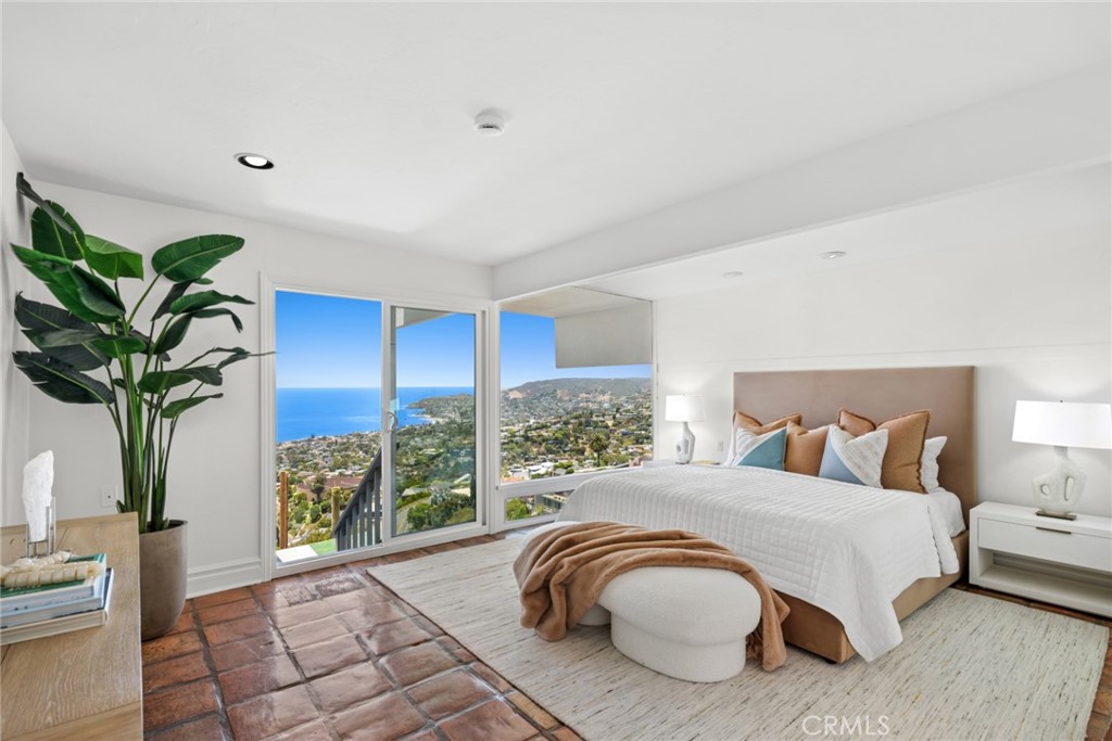 Multiple ocean-view decks create seamless indoor-outdoor living, while the primary suite offers the incredible luxury of - 1105 Summit Drive, Laguna Beach CA 92651 - photo 14
