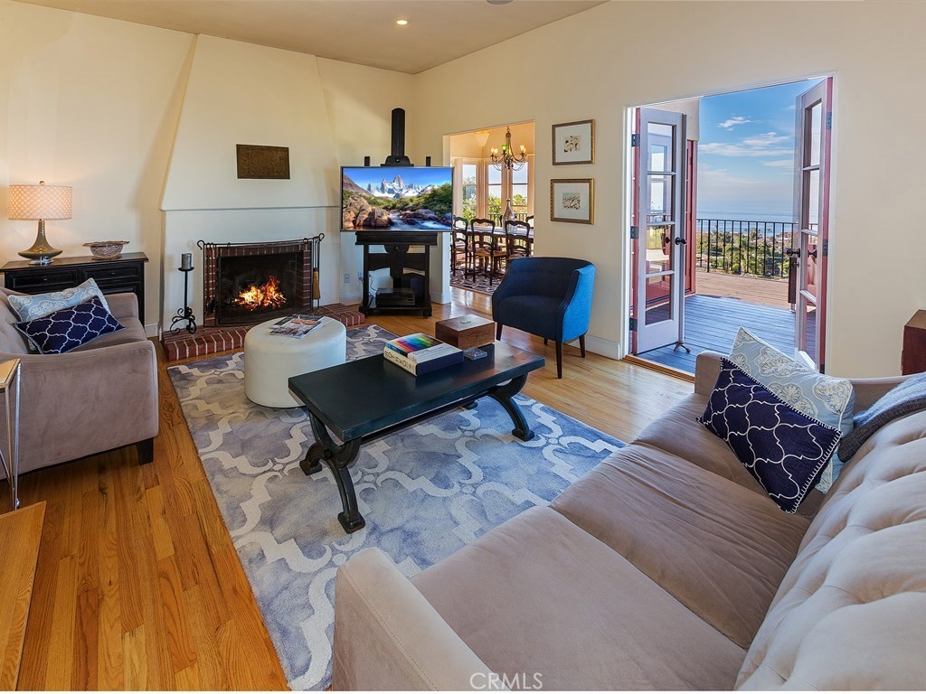 Cozy living room that opens to the generous ocean view deck - 1107 Coast View Drive, Laguna Beach CA 92651 - photo 1