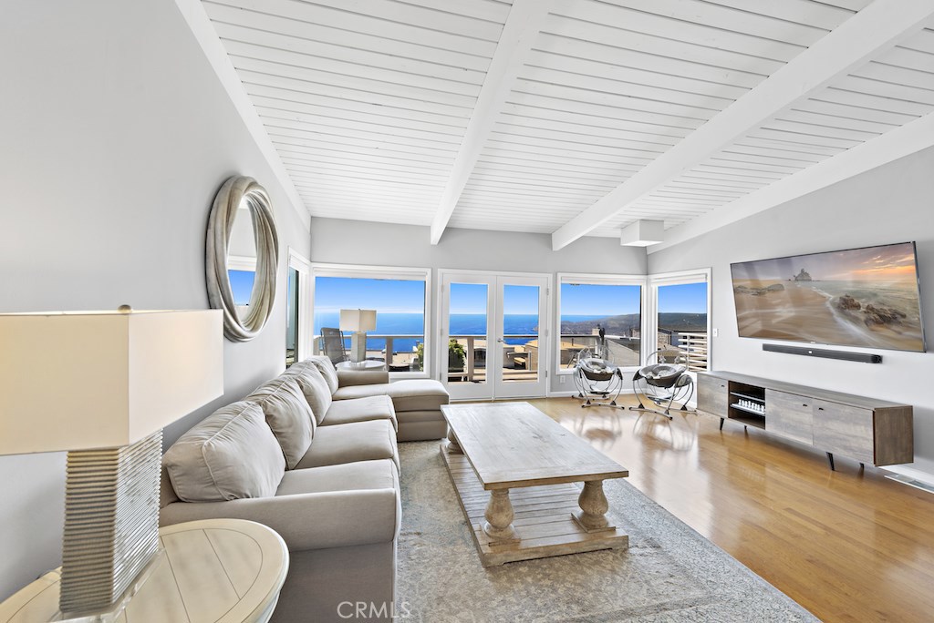 Main floor living room and kitchen feature expansive ocean, Catalina, and coastline views all the way to Palos Verdes! - 1116 La Mirada Street, Laguna Beach CA 92651 - photo 1