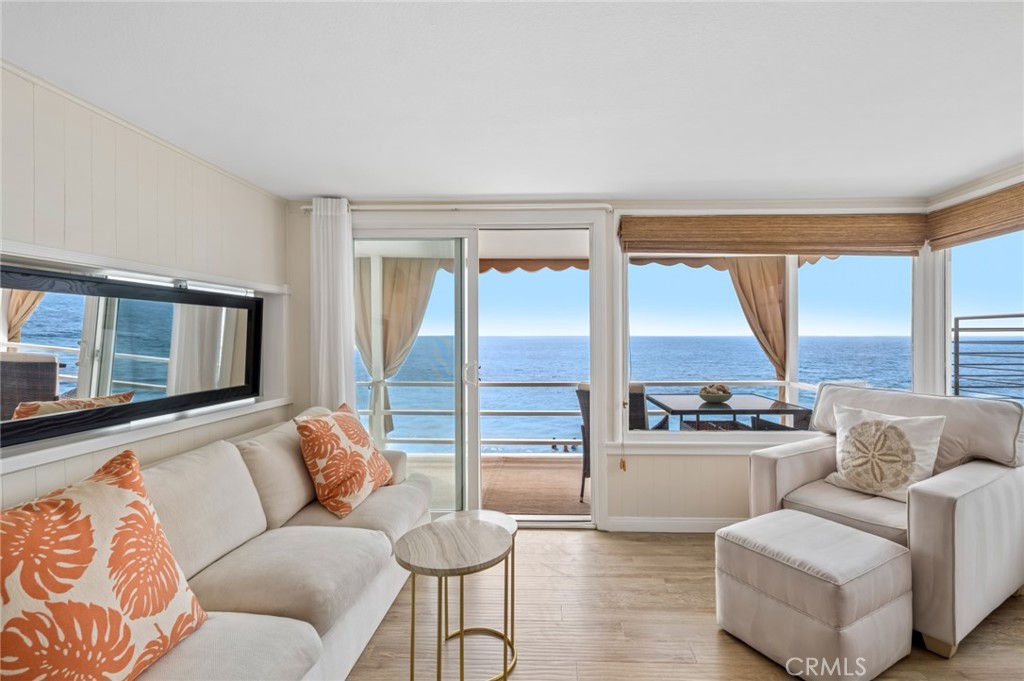 Upon entry, you’re immediately welcomed by an airy interior framed by sparkling coastal vistas, creating a seamless conn - 1139 Gaviota Drive, Laguna Beach CA 92651 - photo 3