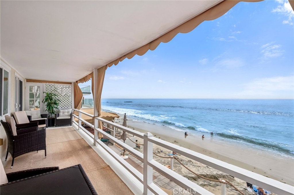 A private deck extends from both the living room and bedroom showcasing an idyllic setting for morning coffee accompanie - 1139 Gaviota Drive, Laguna Beach CA 92651 - photo 4